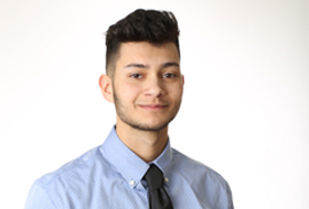 Male La Roche University student dressed in professional clothing.